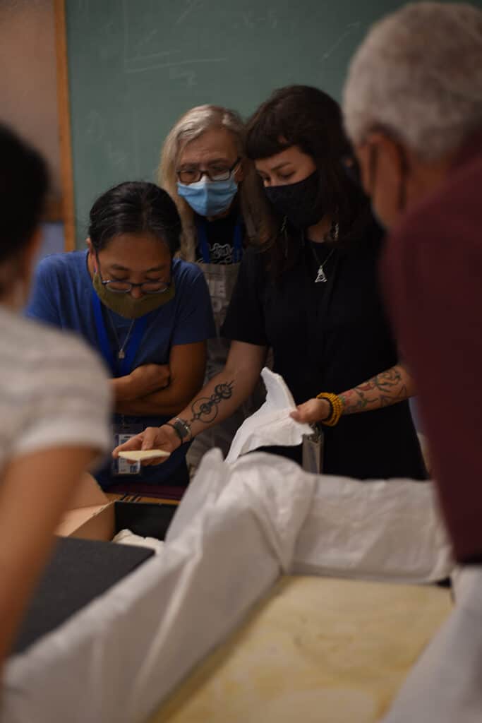 Field Museum staff opens up the Archaeopteryx fossil they just received.