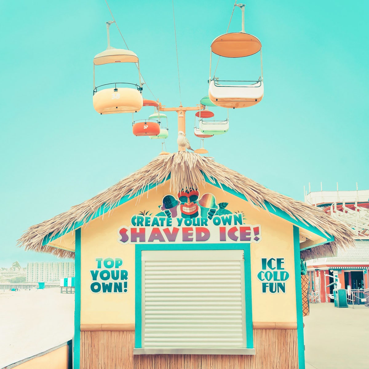 Sky Glider over shaved ice hut in Santa Cruz Boardwalk